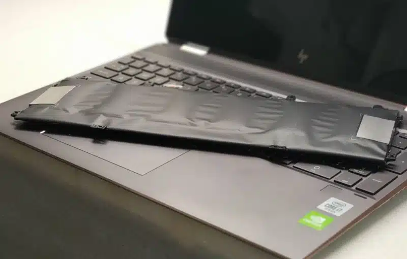 swollen laptop battery on keyboard