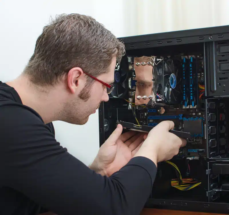 gaming pc technician working on pc