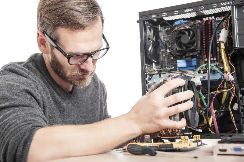 computer technician installing a cooling system.